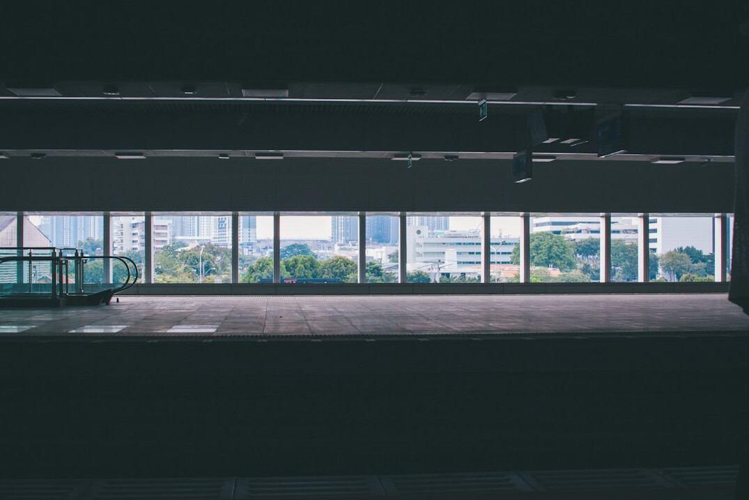 Modern open office interior with large windows